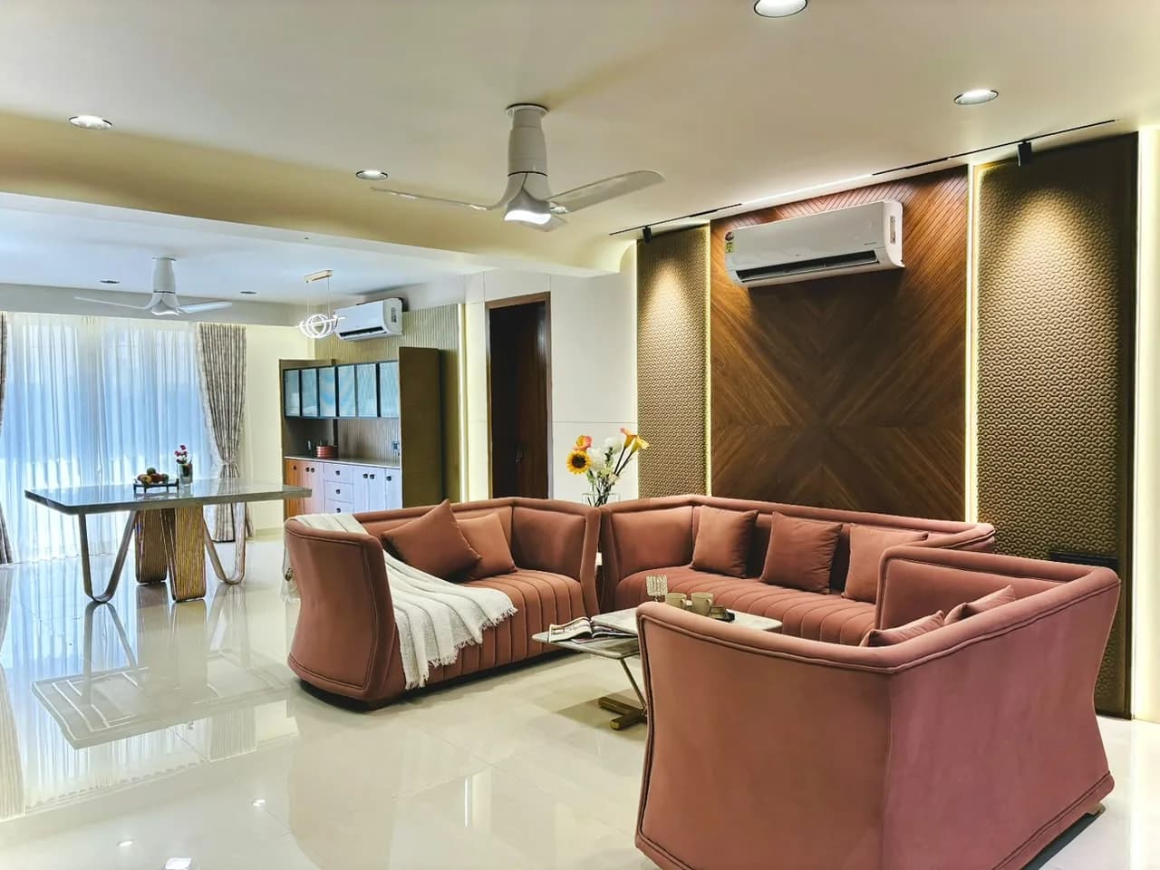 Kotecha Apartment — A completed apartment interior with warm timber, soft colour and compact custom storage.