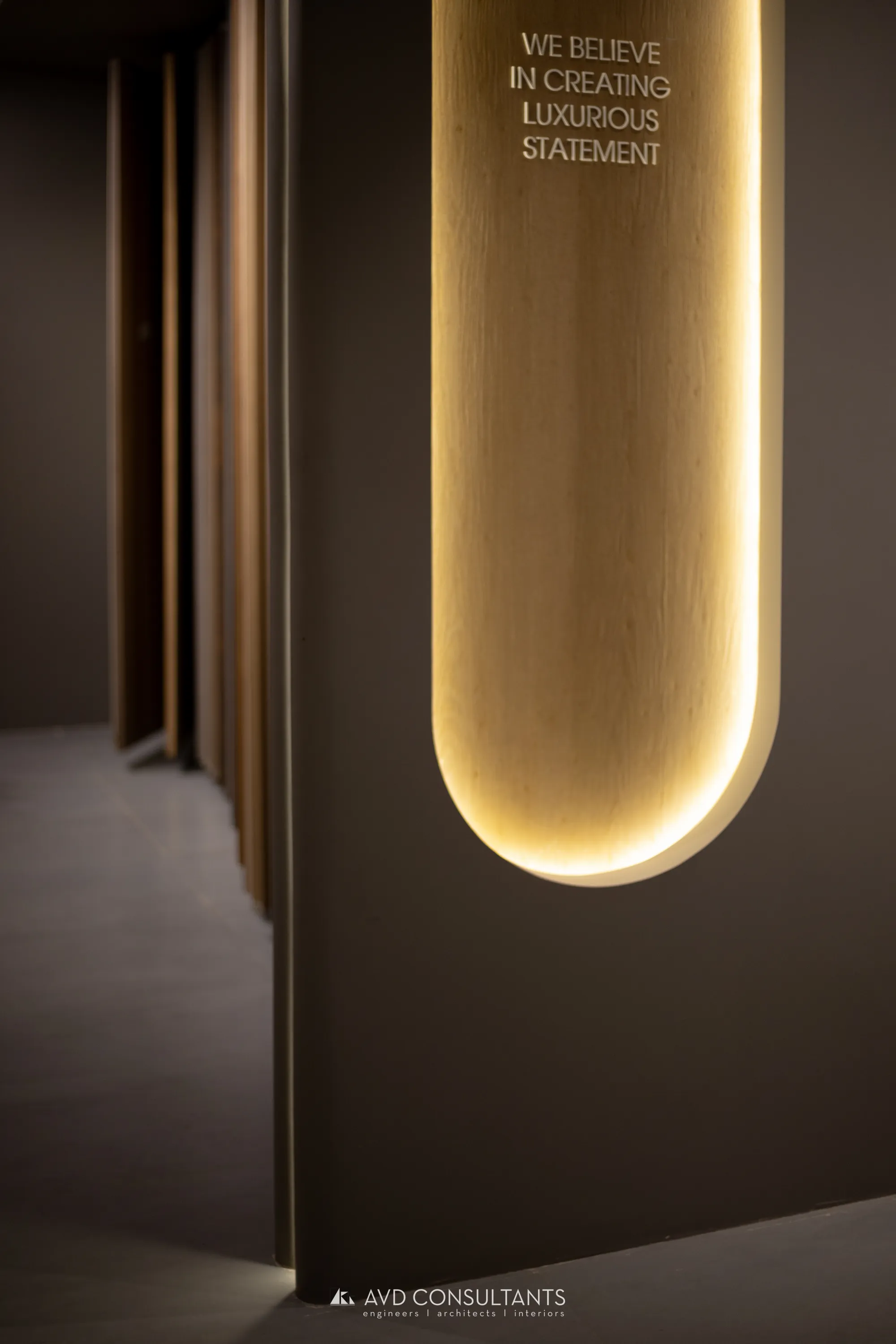 KAAZ Showroom — A three-storey veneer and laminate display space where wood, metal and raw concrete argue politely.
